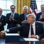 Trump Backs Down, Signs Covid Stimulus Package