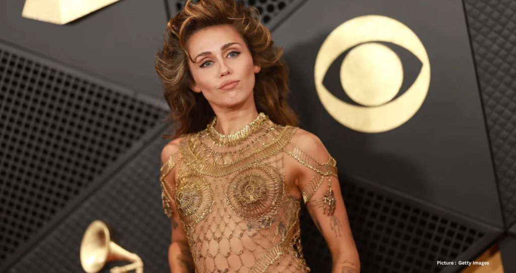 Miley Cyrus Shines in 14,000 Gold Safety Pins: A Fashion Spectacle at the Grammys