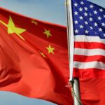 Feature and Cover Dow Jones Drops as China Issues Tariff Warning to US