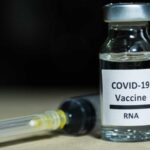 Feature and Cover mRNA Research Reductions Raise Concerns Over Future Pandemics