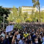 Feature and Cover Iranians Gain Limited Access to International Calls Amid Internet Blockade