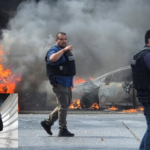 Featured & Cover Tourists Describe Experience Amid Violence Following El Mencho's Death