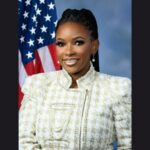 Featured & Cover Far Left Activist Faces Scrutiny Over Bodyguard's Criminal Background