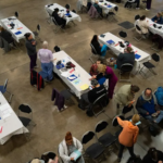 Featured & Cover Americans Camp Overnight for Free Healthcare Amid Rising Costs