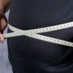 Featured & Cover Weight Gain During Middle Age Linked to Increased Health Risks
