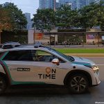 Featured & Cover Robotaxi Departures from Airport with Passenger's Suitcase