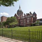 Featured & Cover Johns Hopkins University Cuts 110 Jobs Amid Federal Funding Reductions